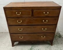 An inlaid mahogany two over three chest of drawers with brass drop handles