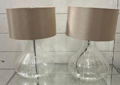 A pair of ribbed glass table lamps