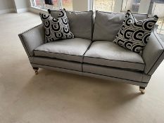 A pair of Duresta two seater sofas in a black and white flecked upholstery and piped in black (H88cm