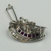 A vintage diamond and ruby brooch, approximate weight 6.6g