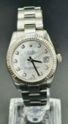 A Mid Size Rolex Oyster Perpetual date-Just watch. Model No 178274 Serial No 1542V493