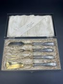 A boxed WMF cheese serving set in the Art Nouveau style