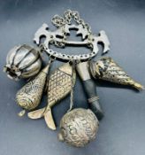 A white metal and hardwood engraved Brazilian Penca de Balangandan, the handle mounted with two