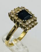 A sapphire and diamond ring, 18ct yellow gold,marked 750 and approximate size M.5