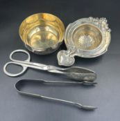 A selection of WMF items to include tea strainer, sugar bowl, cake serving tongs, sugar nips.
