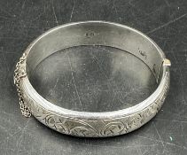 A silver hinged bangle hallmarked for Chester 1956 Joseph Smith & Sons (Birmingham) Ltd