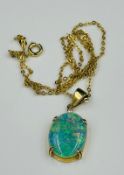 An opal pendant (20mm x 15mm) on a marked 750 setting and fine necklace.