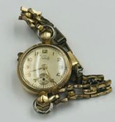 A 9ct gold Verity Ladies wristwatch on rolled gold bracelet