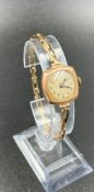 A 9ct gold ladies watch on 9ct gold expandable bracelet, combined approximate total weight 13.4g