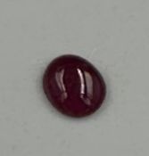A ruby cabochon stone 6mm