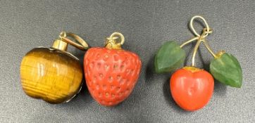Three fruit themed pendants on 18ct gold mounts