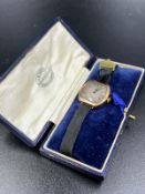 A Ladies 9ct gold watch on ribbon bracelet