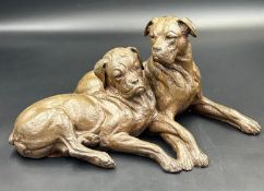 A pair of boxer dog figures signed to back for Doris Linder.