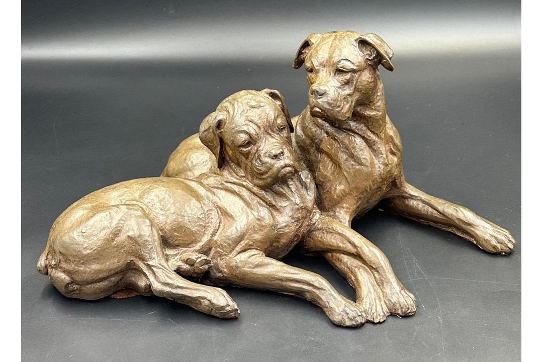A pair of boxer dog figures signed to back for Doris Linder. - Image 1 of 2