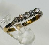 An 18ct gold and platinum set five stone diamond ring,approximate size O and weight 2.1g