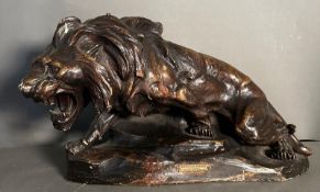 After Thomas Cartier a bronzed plaster model of a roaring lion, titled Lion En Furie signed lower