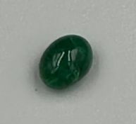 An emerald cabochon stone 9mm