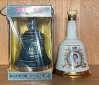 Two Bells commemorative bell shaped decanters, one Bells 20 year old and another commemorative to