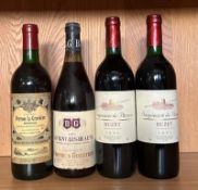 A bottle of Chateau Perron La Gaviere 1983, a Savigny Les Beaune 1973 and two bottles of