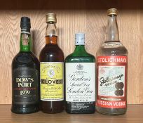 Four bottles of spirits, a Dows port, an Alcoholic Clove Cordial, A Gordons Gin and a Stolichnya