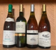 A bottle of Petit Chabis 1995, a Colombard Sauvignon 2012m a Vouvray 1999 and a Chablis 1995