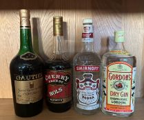 Four bottle of spirits, A Gaultier Cognac, a Bols Cherry brandy, a Smirnoff Vodka and a Gordon dry