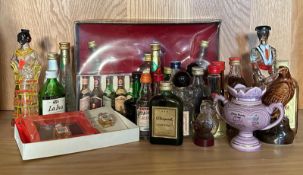 A quantity of miniatures to include White Horse whisky, Bisquit Cognac and Grappa