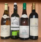 A bottle of 1997 Pouilly Fume, a bottle of Vevgeac Sec, a 1995 Petit Chablis and a 2006 Bordeaux