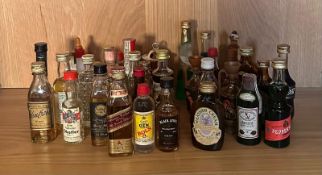 A quantity of miniatures to include Heatner Cream, Johnnie Walker red label and Bols gin