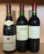 A bottle of Baroons De Rothschild Medoc 2003, a Chateau La Blanque Saint Emillion Grand Cru 1992 and
