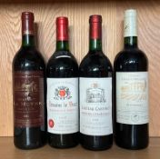 A bottle of Chateau La Mothe 1990, a Domaine De Viaut 1998, a Chateau Cantinot 1998 and a Chateau