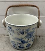 A Booths blue and white porcelain slop bucket with cane handle