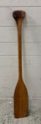 A wooden kayak paddle