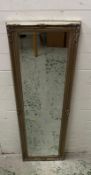A silver painted bevel edged hall mirror with floral detail 41cm x 132cm