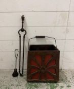 A vintage coal bucket along with a set of tongs and a brush
