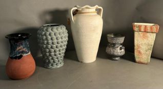 A selection of five glazed and unglazed vases in various styles