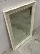 A white painted hall mirror with floral details 63cm x 88cm
