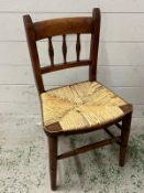 A rush seated child's chair