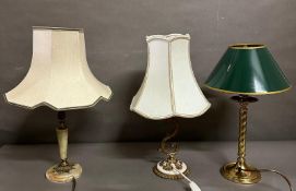 Three table lamps in onyx, brass and one in gold painted Rococo style