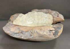 A large organic carved bowl with pearlized centre 45cm x 45cm