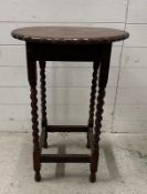A circular crimped top side table on barley twist legs (H73cm Dia50cm)