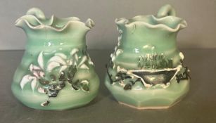 Two vintage Chinese creamers, green grounds and with painted Jasmine flower reliefs