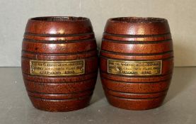 A pair of miniature teak barrels made from the timbers of HMS iron Duke and dated 1916