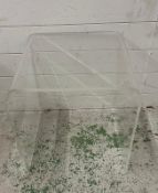 A clear Perspex arched side table (H45cm W45cm D43cm)