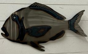 A metal wall art of a fish 66cm x 37cm
