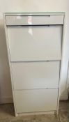 A white gloss three tier shoe rack with single drawer over and glass top (H135cm W63cm D24cm)