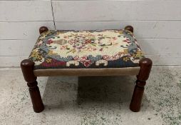 A mahogany framed florally upholstered footstool (H33cm W60cm D47cm)