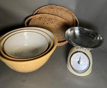 Kitchen scales and a trio of mixing bowls and two baskets