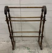 A vintage beech bathroom towel rail