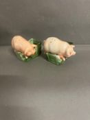 Two vintage ceramic pig ashtrays